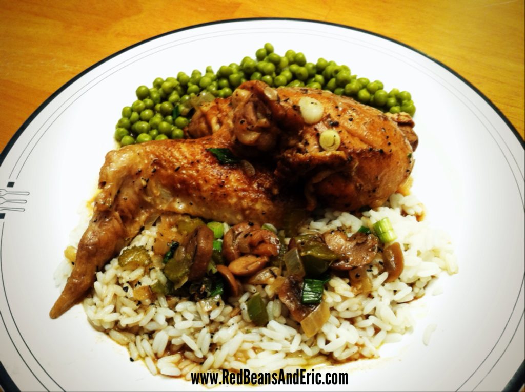 New Orleans style Stewed Chicken over hot white rice and a side of green peas