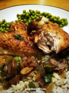 New Orleans style Stewed Chicken over hot white rice and a side of green peas